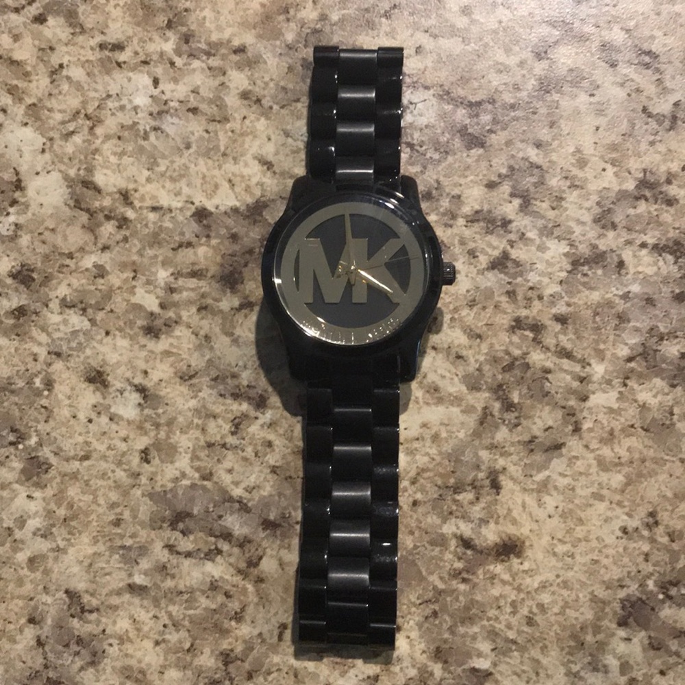 Michael Kors women’s watch in black and gold